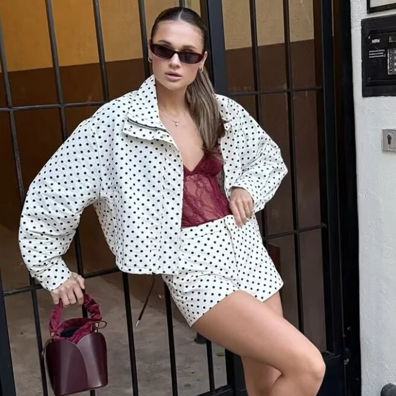 Comfortable oversized polka dot bomber jacket in white with black dots, a collared zip front and matching shorts.