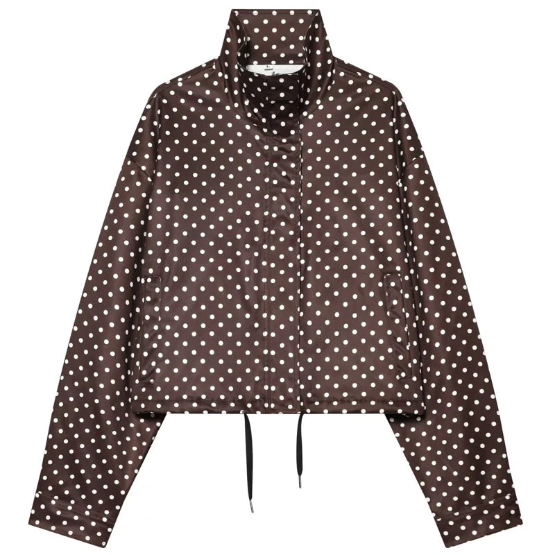 comfortable oversized polka dot bomber jacket in dark brown fabric with white dots, a high collar, front pockets and drawstrings.