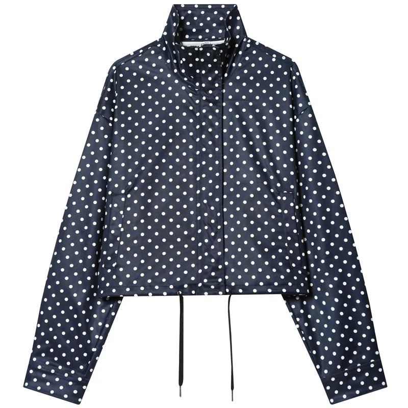 comfortable oversized polka dot bomber jacket, a navy fabric style with white dots, a high collar, zip front and drawstring hem