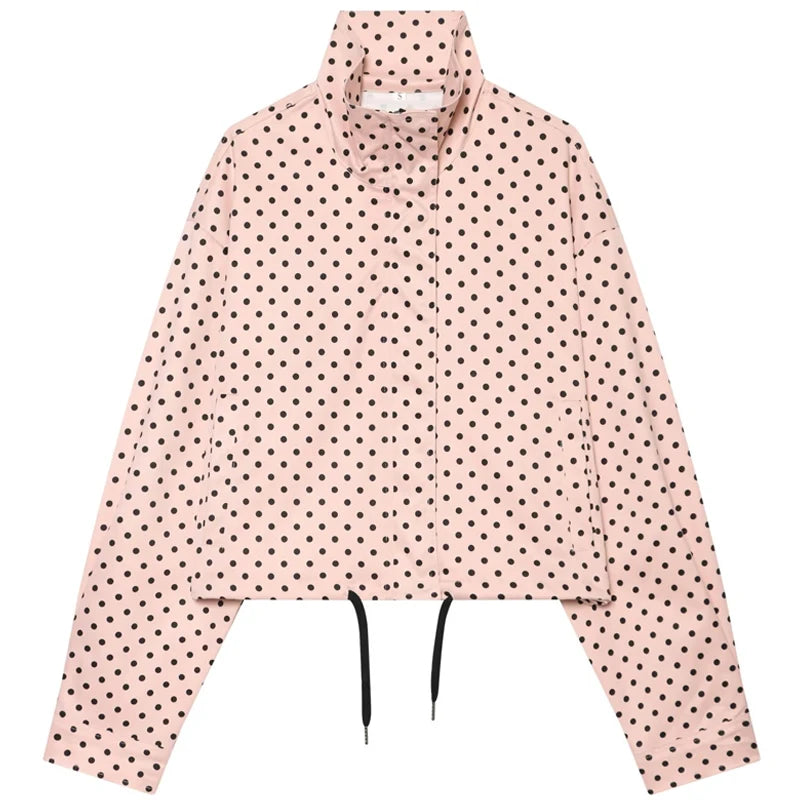 comfortable oversized polka dot bomber jacket in pale pink lightweight fabric, covered in black dots with a collar and drawstring hem