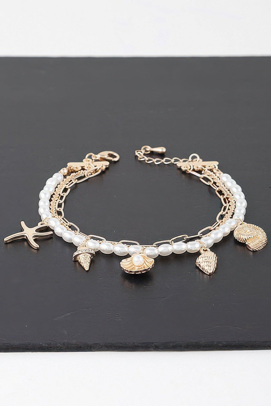 The bracelet's clasp and chain detail shown from the side