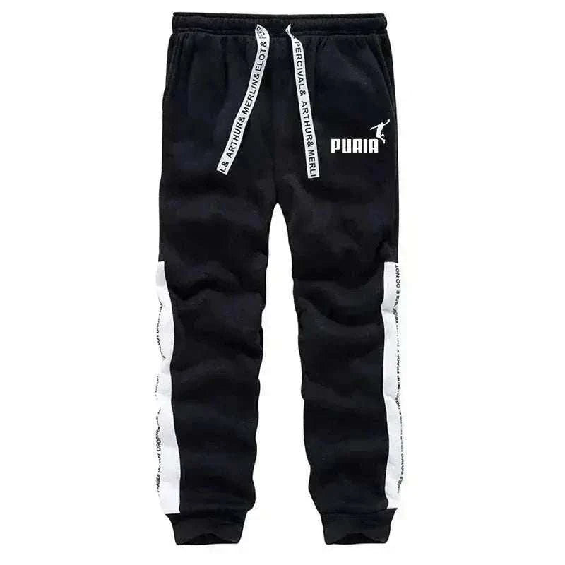Men's Tracksuit pants in black with white side panels, branded drawstrings, Puma logo and ribbed ankle cuffs